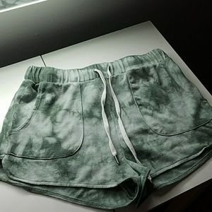 Green tie-dye shorts